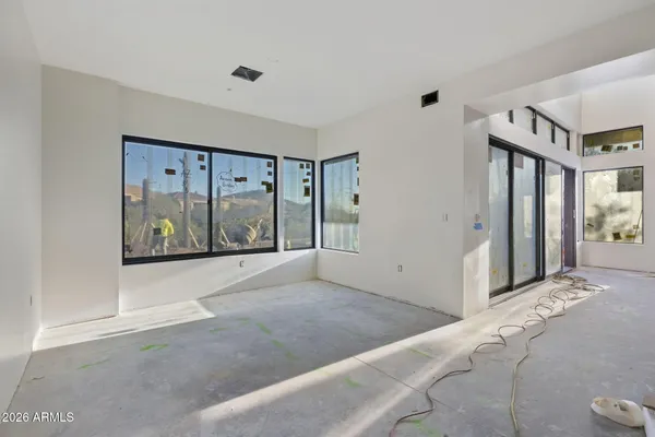 a view of an empty room with a balcony