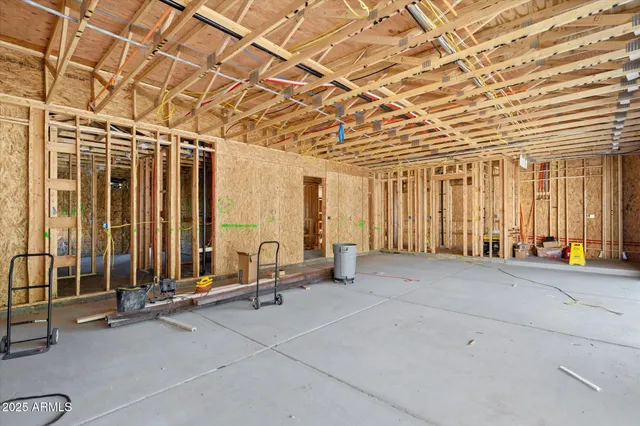 a view of a patio with table and chairs