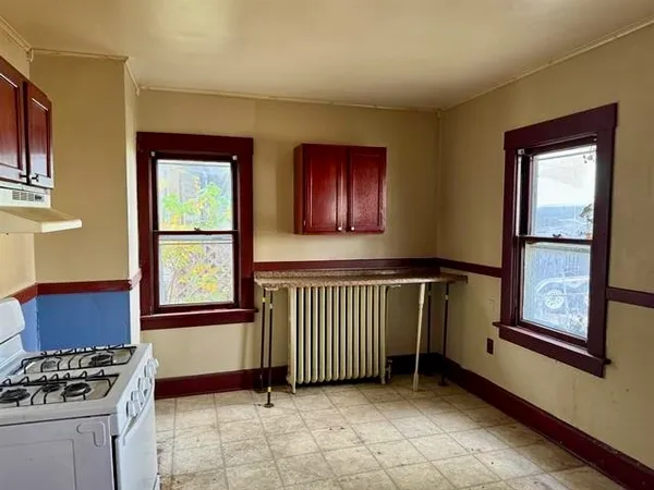 a view of a livingroom with furniture and windows