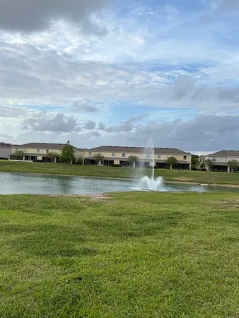 a view of a lake with houses in the back