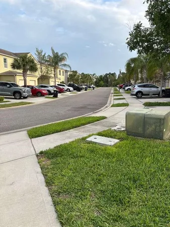 a view of outdoor space with garden and car parked