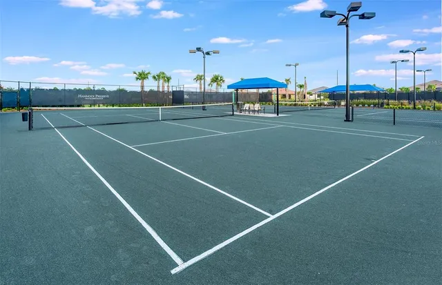 an aerial view of a house with garden space and lake view