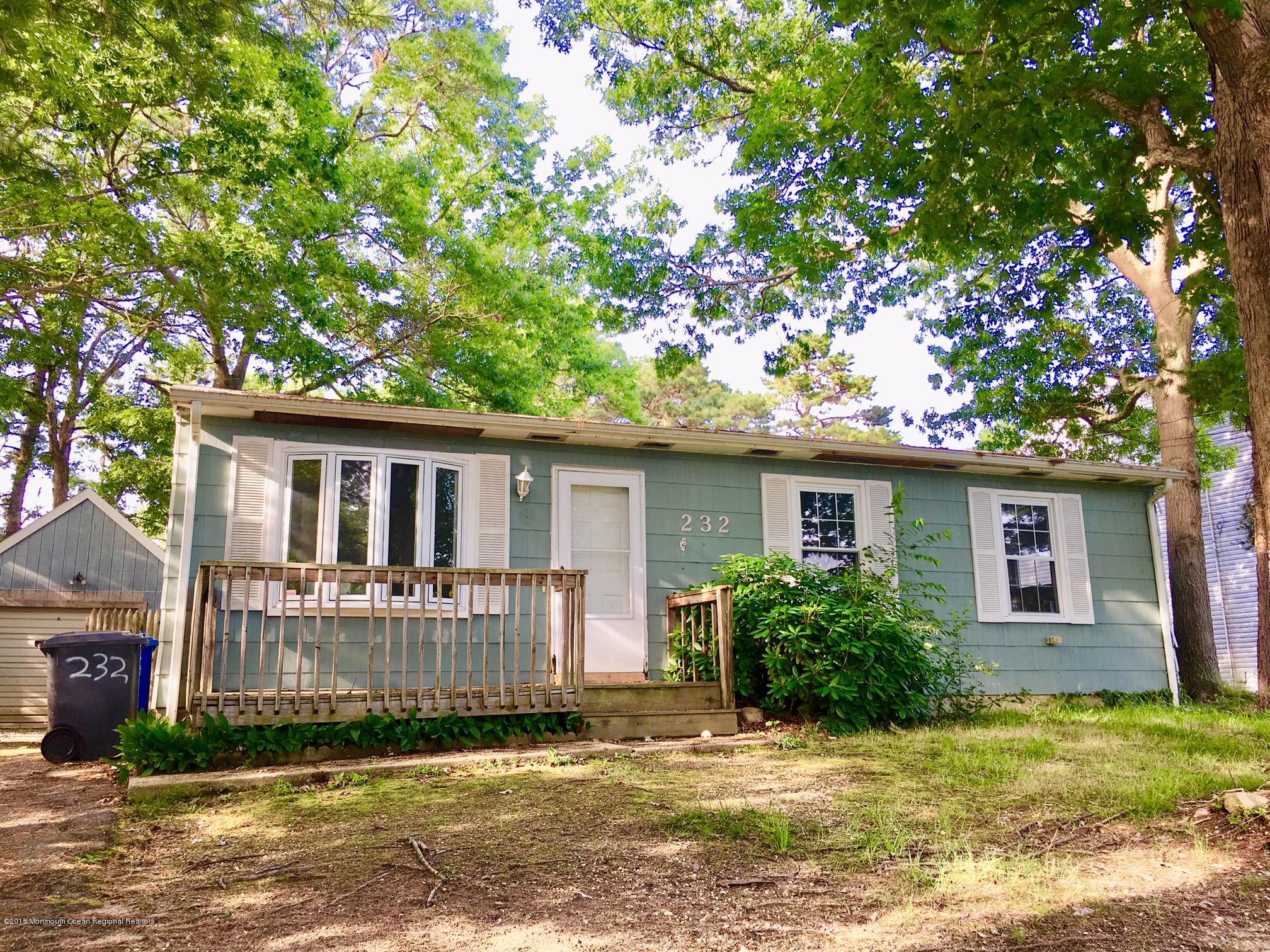 232 Compass Road Manahawkin, NJ 08050 - Photo 1 of 17 front view of a house with a yard