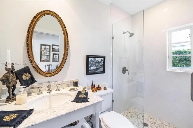 a view of a patio with table and chairs potted plants and palm tree