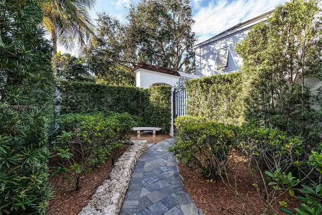 a view of a dining room with furniture wooden floor and chandelier