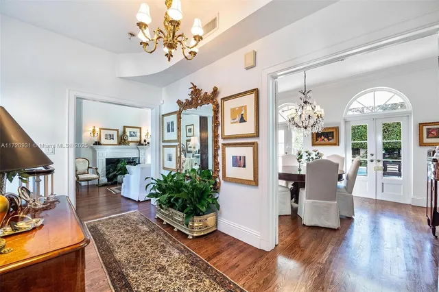 a view of a hallway to rooms