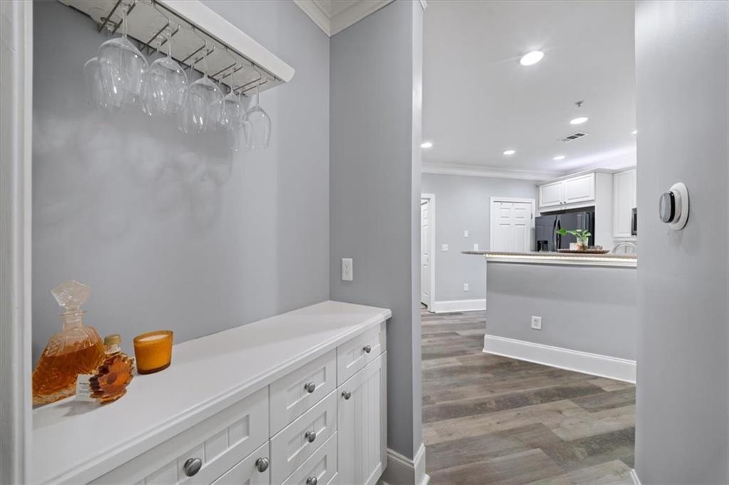 4100 Paces Walk Southeast, Unit 1101 Atlanta, GA 30339 - Photo 12 of 36 a kitchen with a sink stainless steel appliances and cabinets