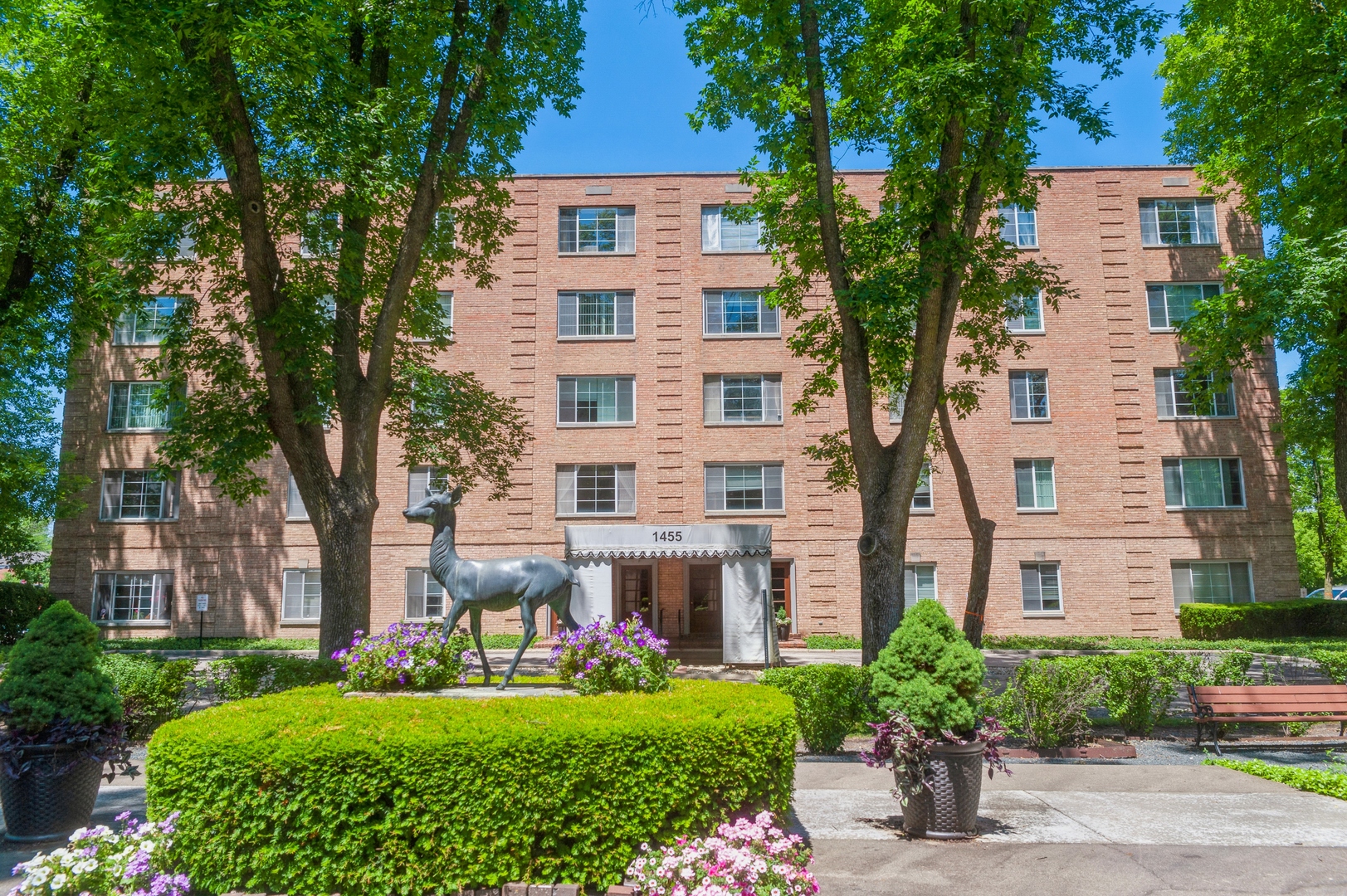 1455 Shermer Road, Unit 503C Northbrook, IL 60062 - Photo 1 of 11 front view of a house with a garden