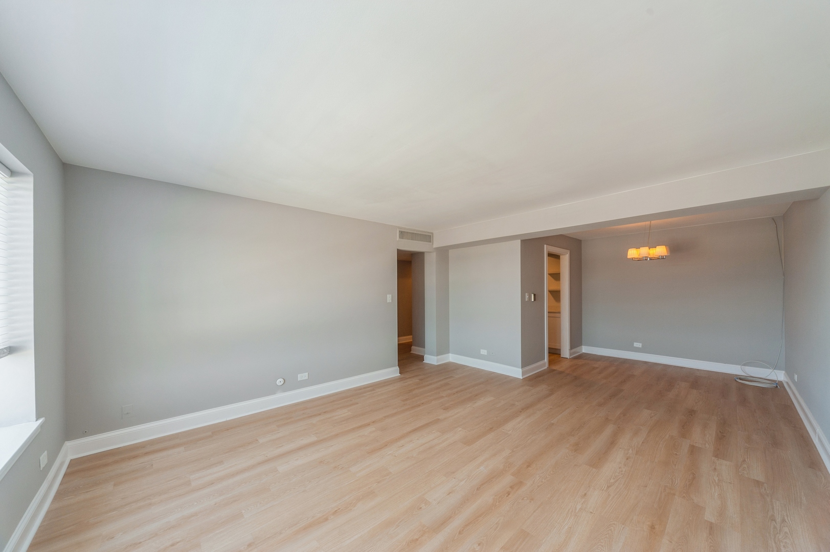1455 Shermer Road, Unit 503C Northbrook, IL 60062 - Photo 4 of 11 an empty room with wooden floor and windows