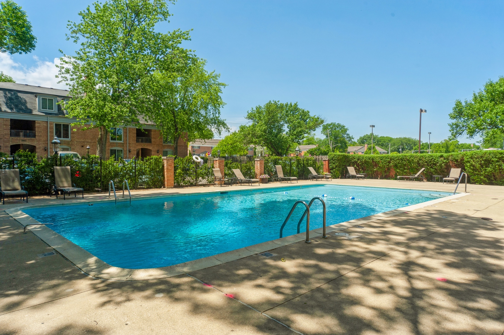 1455 Shermer Road, Unit 503C Northbrook, IL 60062 - Photo 8 of 11 a view of a swimming pool with a patio