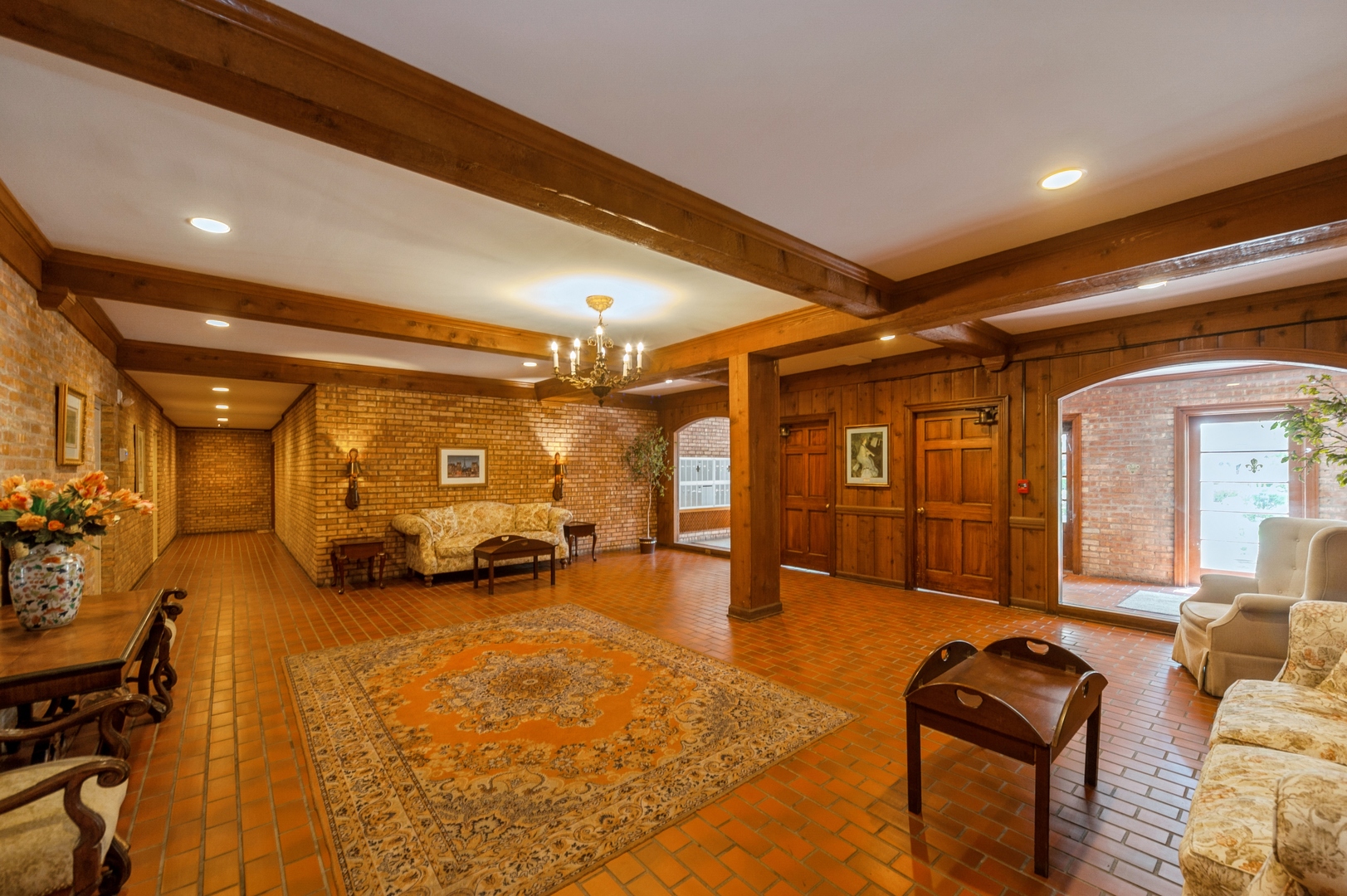 1455 Shermer Road, Unit 503C Northbrook, IL 60062 - Photo 9 of 11 a living room with furniture and a chandelier