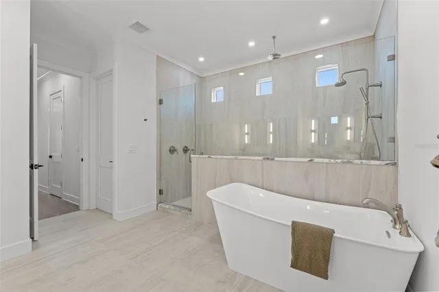 a bathroom with a double vanity sink toilet and shower