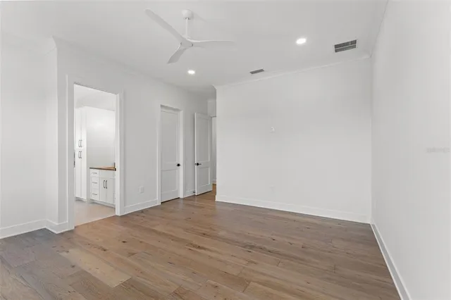 a kitchen with stainless steel appliances granite countertop white cabinets a sink and dishwasher