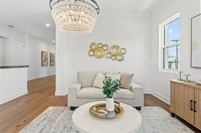 a kitchen with center island table and chairs