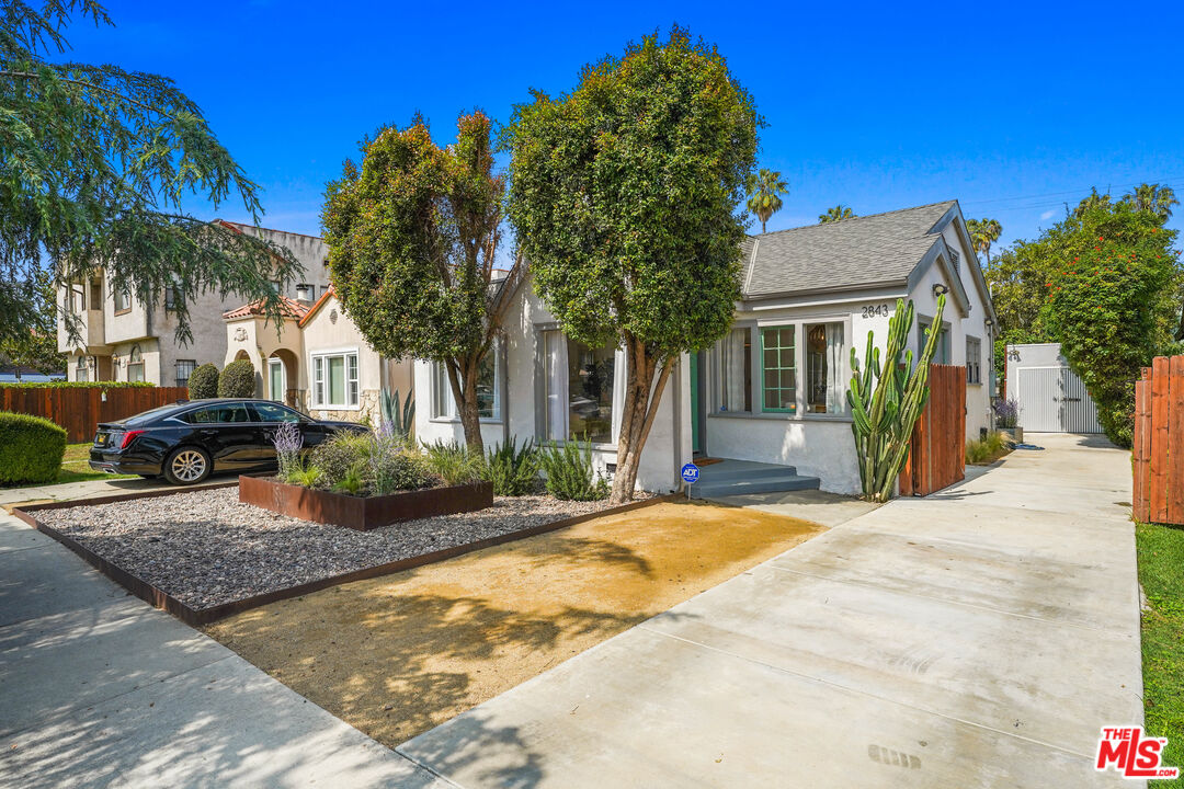 2843 Virginia Road Los Angeles, CA 90016 - Photo 1 of 2 a front view of a house with garden