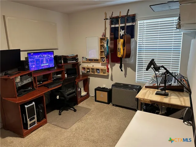 a room with furniture and flat screen tv