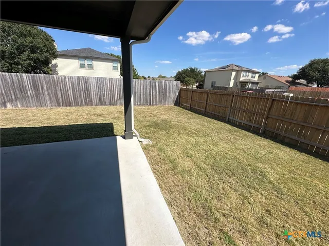a view of balcony with wooden floor