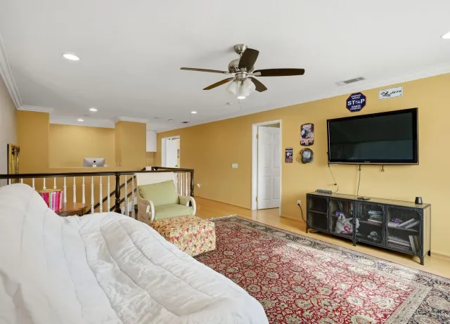 a view of a livingroom with furniture and a flat screen tv