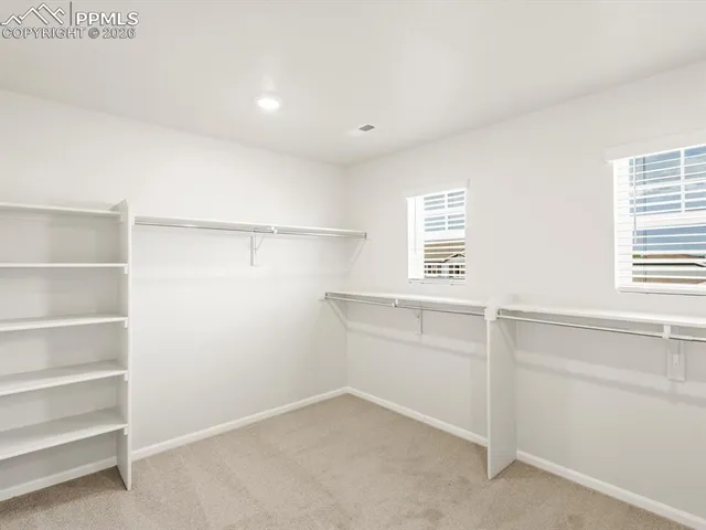 a view of walk in closet with window