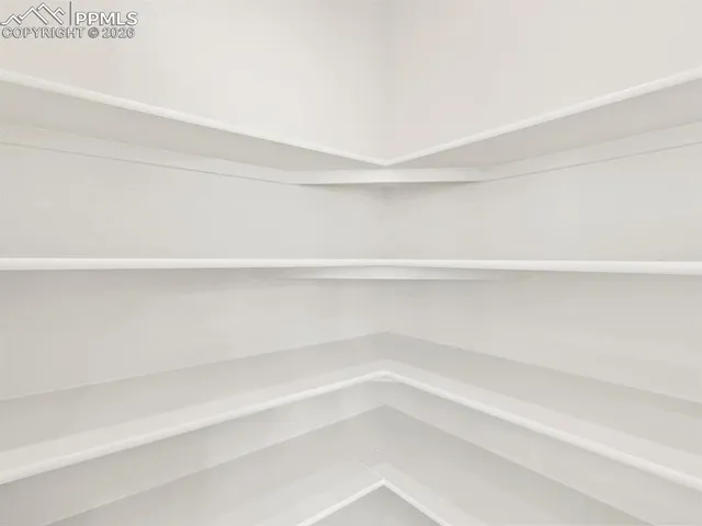 a view of a closet with shelves