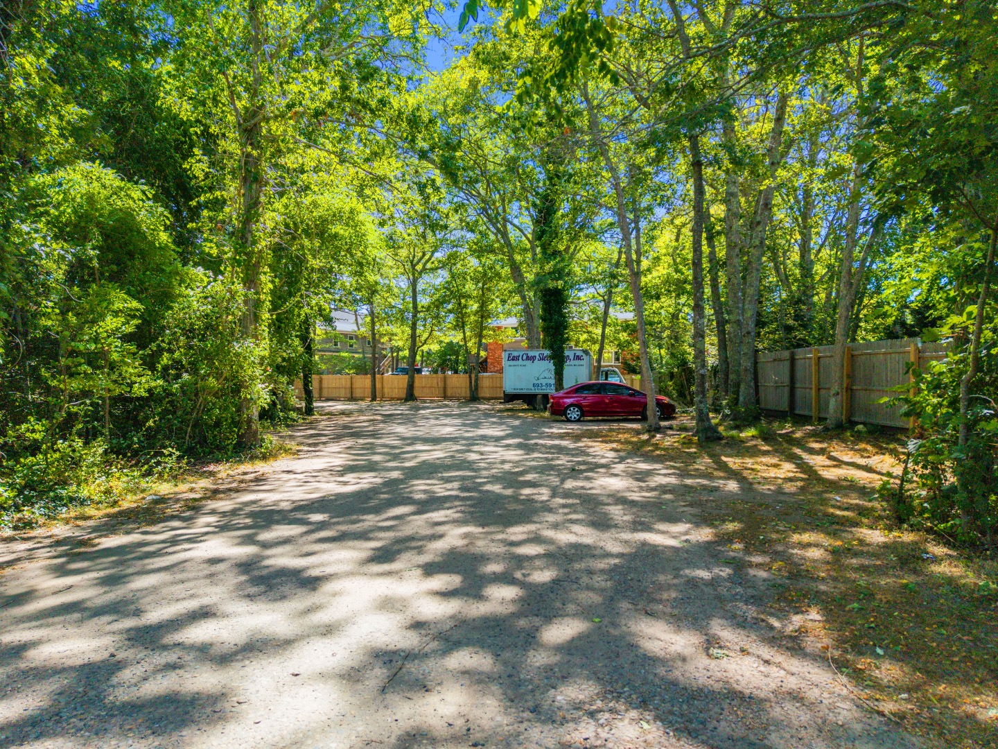 0 State Road Vineyard Haven, MA 02568 - Photo 1 of 7 a backyard of a house with trees and entertaining space