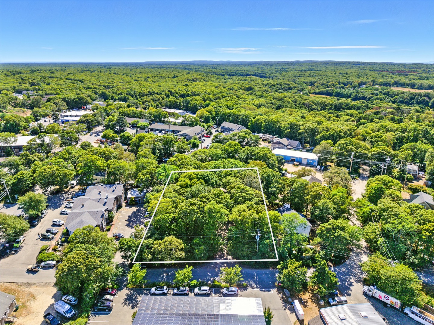 0 State Road Vineyard Haven, MA 02568 - Photo 6 of 7 an aerial view of residential houses with outdoor space and trees