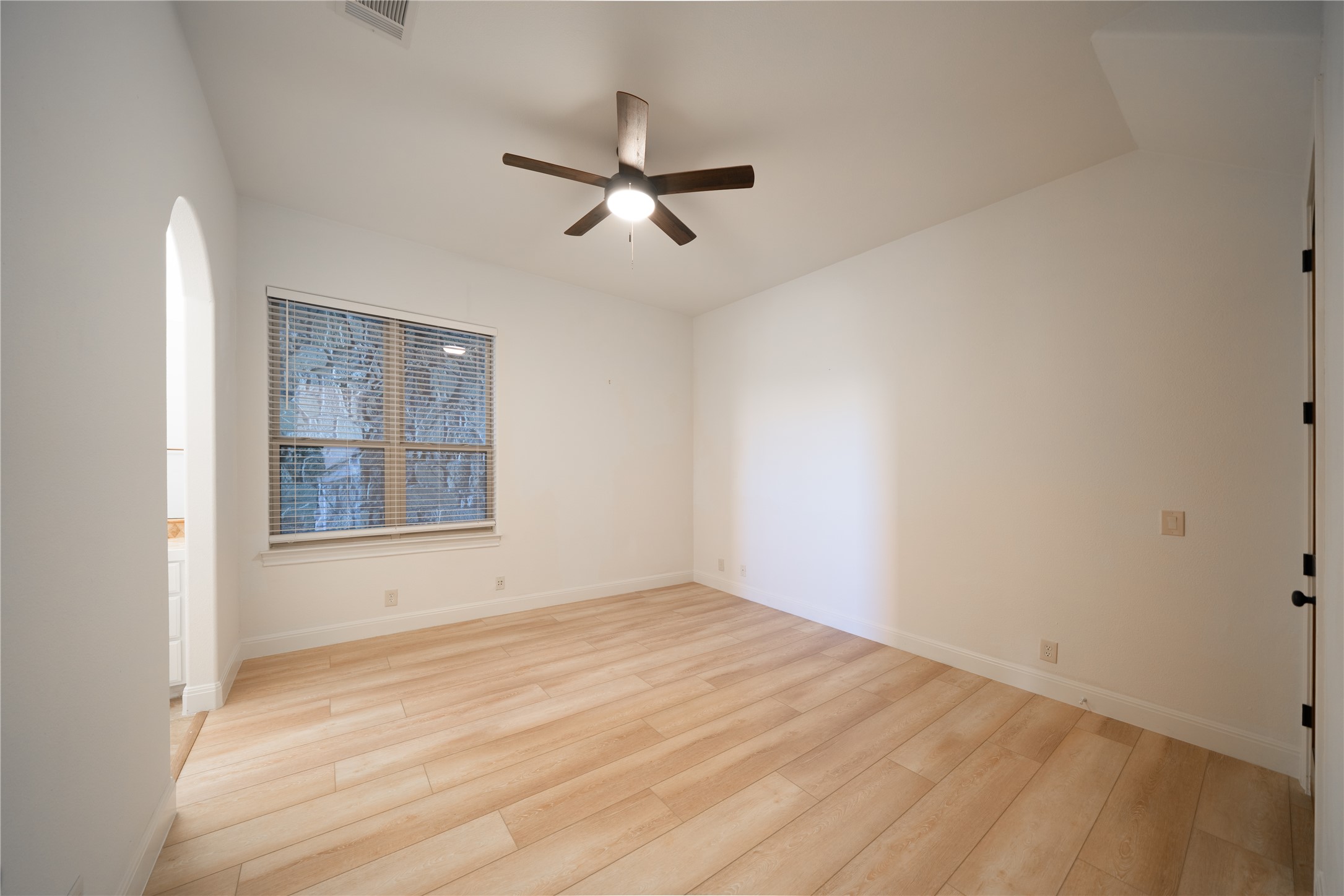 17545 West Reed Park Road, Unit 2 Jonestown, TX 78645 - Photo 26 of 39 a view of empty room with windows