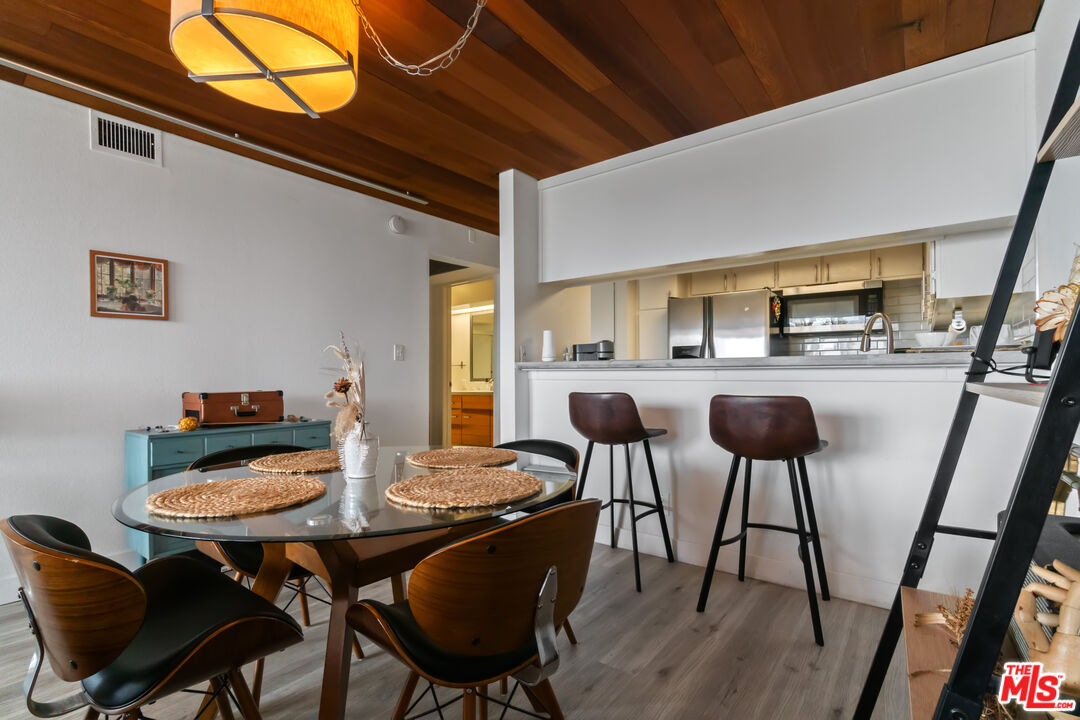 6209 Pacific Avenue, Unit 103 Playa del Rey, CA 90293 - Photo 12 of 40 a view of a dining room with furniture and wooden floor