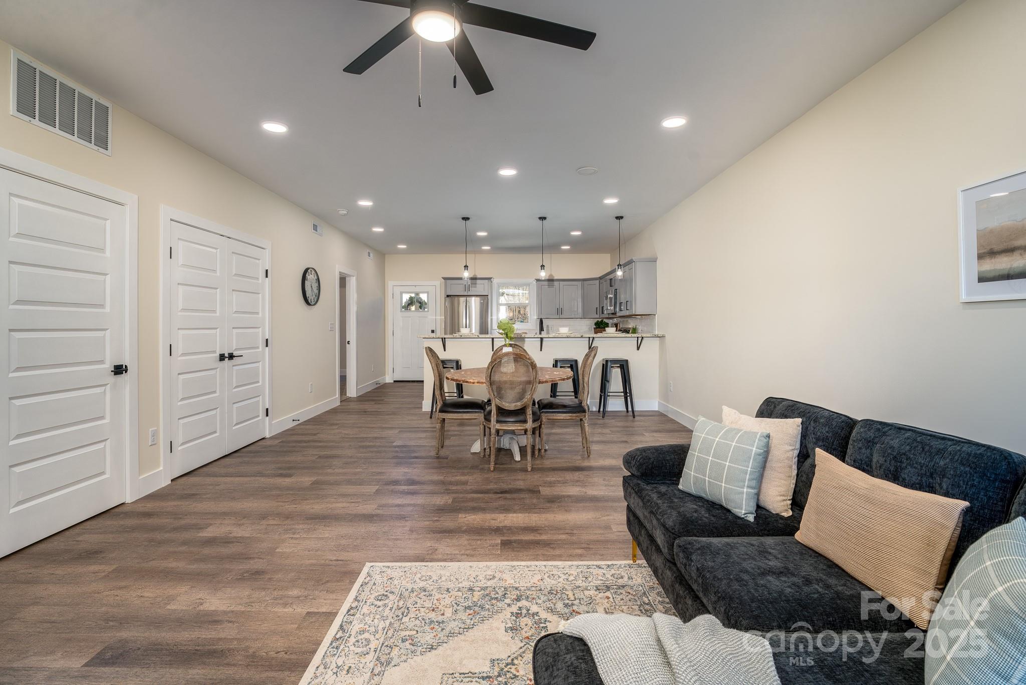143 Carver Street, Unit 1 Brevard, NC 28712 - Photo 7 of 23 a living room with furniture and kitchen view
