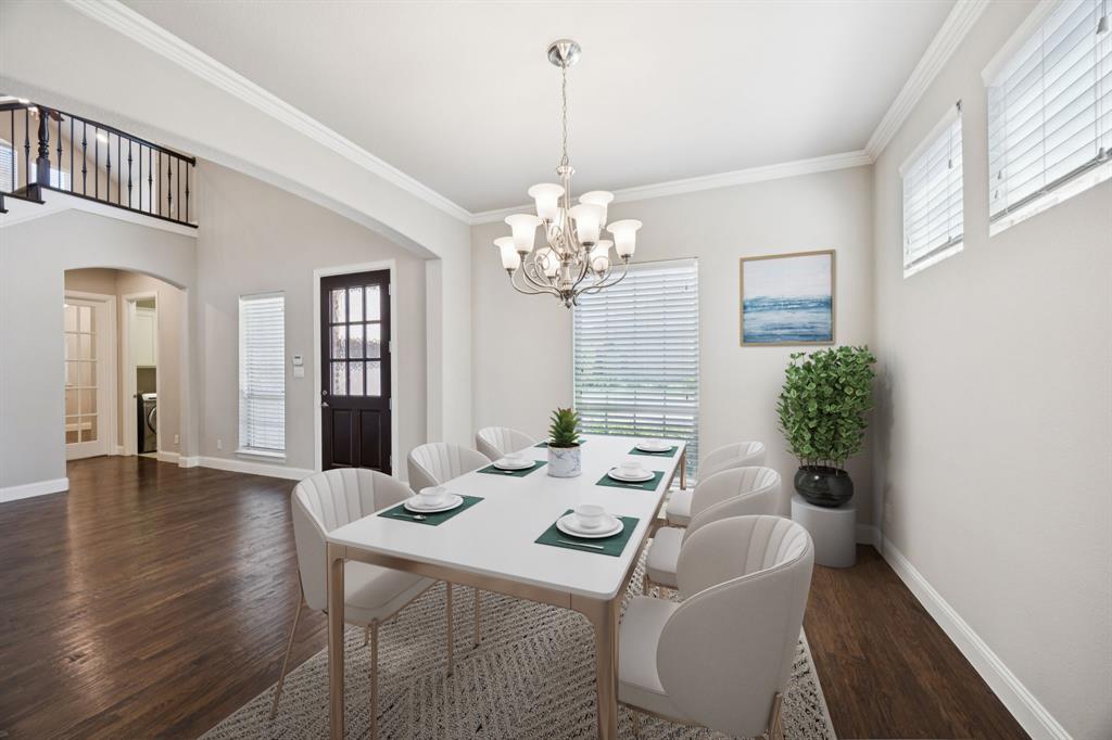 965 Touchstone Road Frisco, TX 75036 - Photo 12 of 36 a dining room with furniture a chandelier and wooden floor