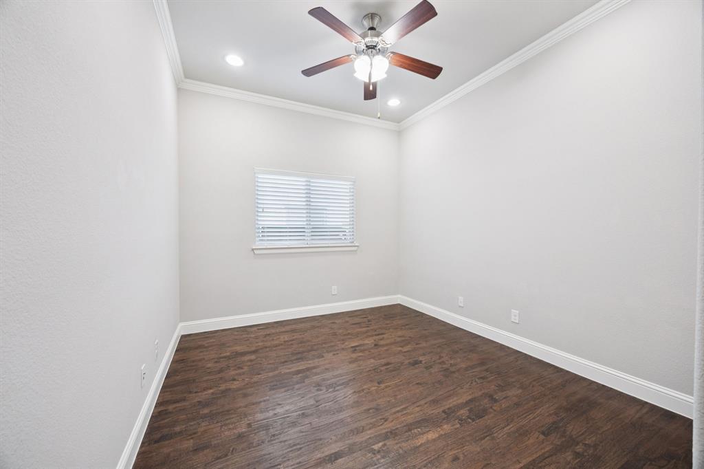 965 Touchstone Road Frisco, TX 75036 - Photo 15 of 36 an empty room with wooden floor ceiling fan and windows