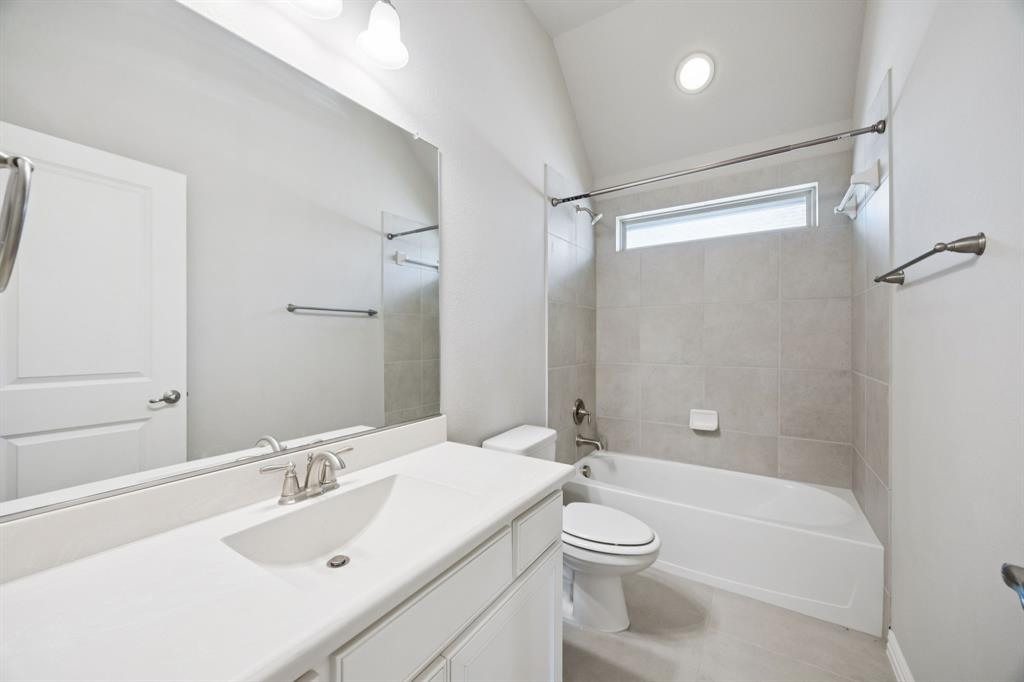 965 Touchstone Road Frisco, TX 75036 - Photo 25 of 36 a bathroom with a sink a toilet and shower