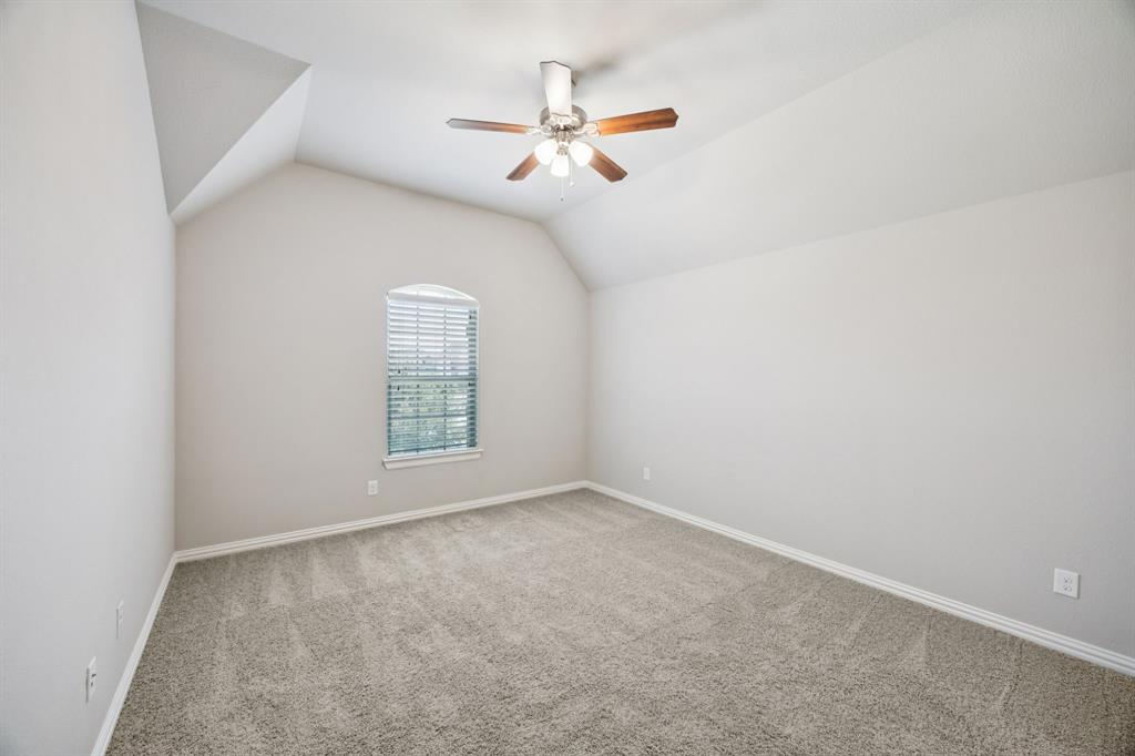965 Touchstone Road Frisco, TX 75036 - Photo 26 of 36 an empty room with a window and a fan