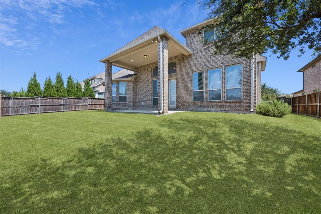 965 Touchstone Road Frisco, TX 75036 - Photo 31 of 36 a view of a house with a yard and a tree