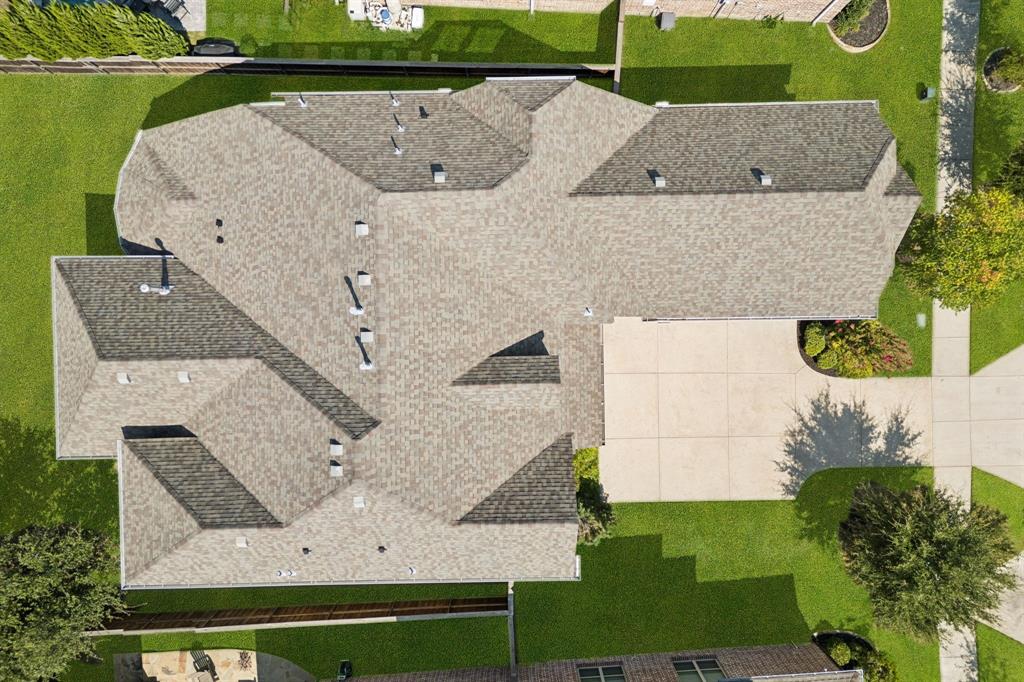 965 Touchstone Road Frisco, TX 75036 - Photo 34 of 36 an aerial view of a house with a garden and trees