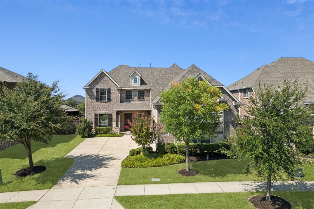 965 Touchstone Road Frisco, TX 75036 - Photo 36 of 36 a front view of a house with a yard