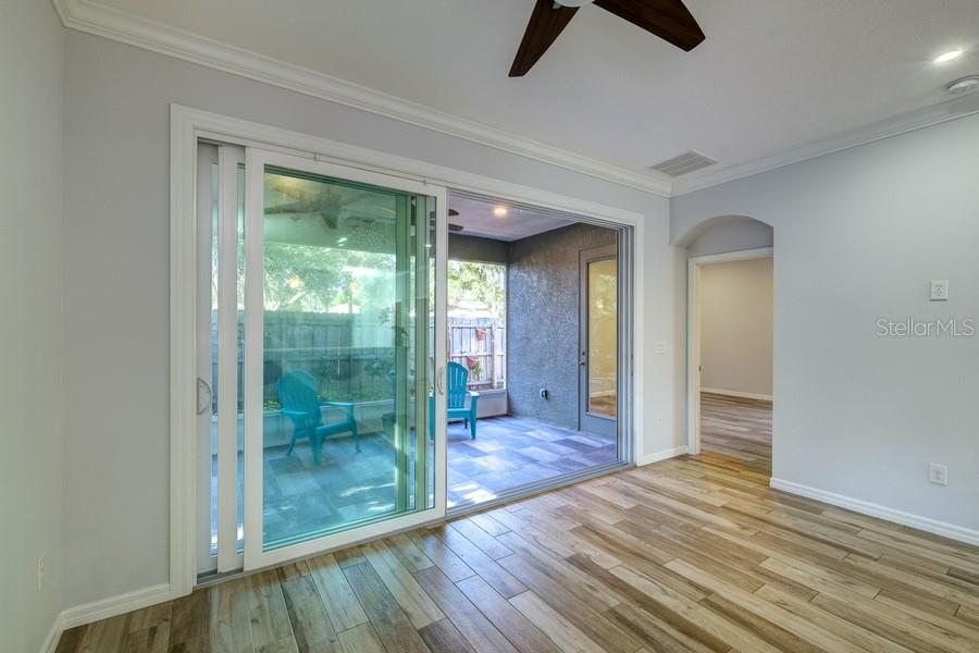 4436 Bliss Road Sarasota, FL 34233 - Photo 12 of 25 a view of a room with wooden floor and a carpet