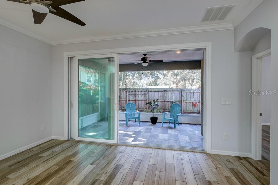 4436 Bliss Road Sarasota, FL 34233 - Photo 13 of 25 a view of a livingroom with wooden floor and furniture