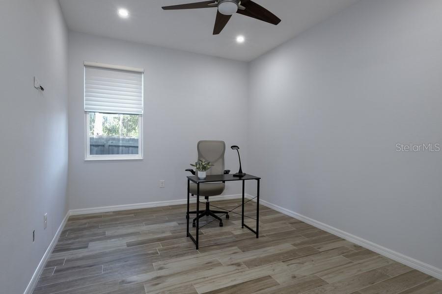 4436 Bliss Road Sarasota, FL 34233 - Photo 17 of 25 a workspace with wooden floor and a window