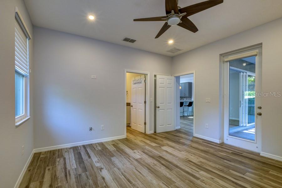 4436 Bliss Road Sarasota, FL 34233 - Photo 25 of 25 wooden floor in an empty room with a window