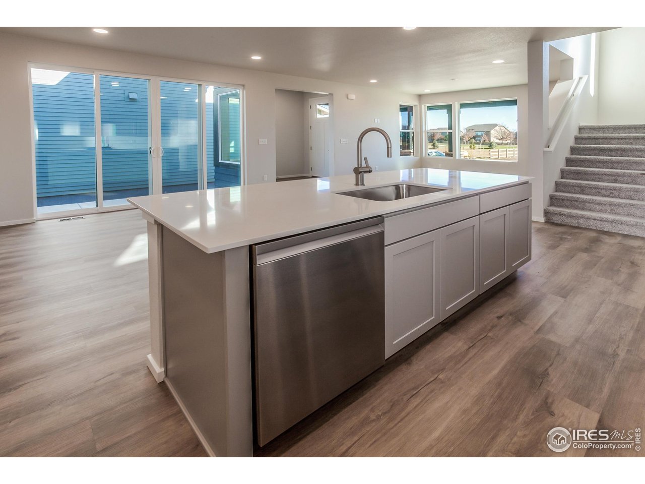 5409 Yancy Street Timnath, CO 80547 - Photo 12 of 48 KITCHEN OPEN TO DINING AND LIVING ROOM