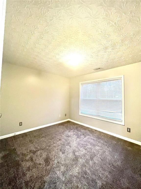 3854 Austin Park Lane Decatur, GA 30032 - Photo 31 of 44 a view of an empty room with a window