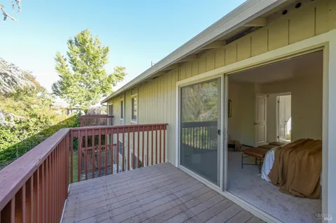 a view of balcony and wooden floor