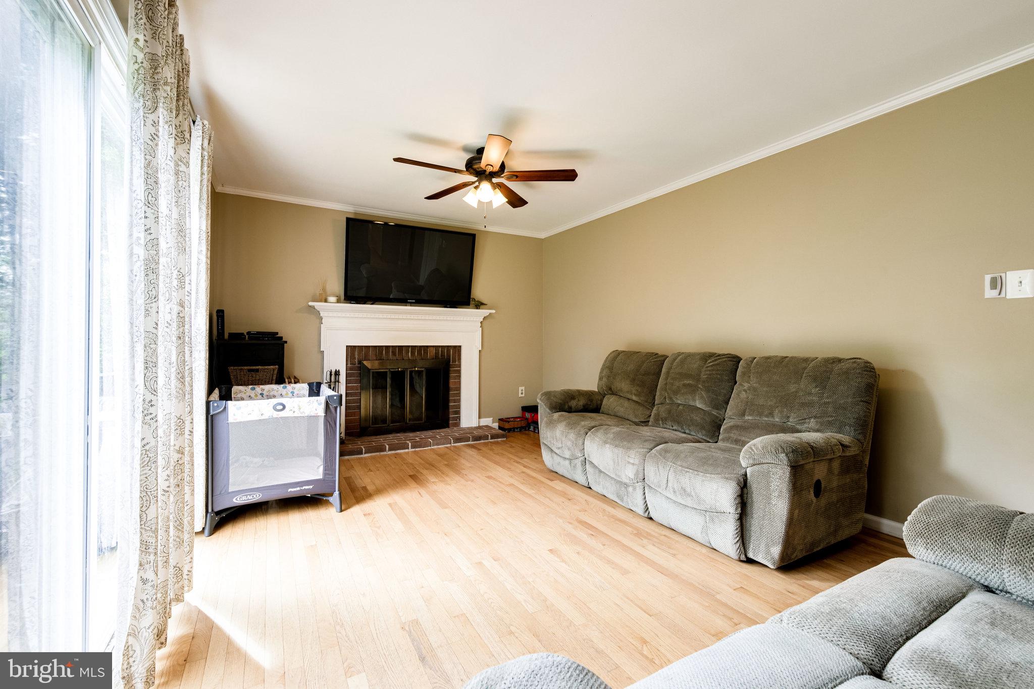 6905 Raspberry Plain Place Springfield, VA 22153 - Photo 31 of 66 Family Rom with Fireplace