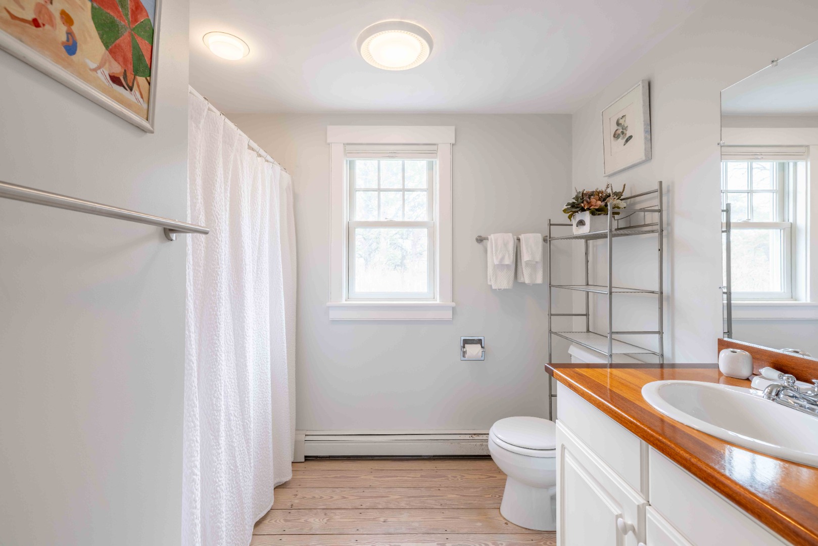 15 Goldfinch Drive Nantucket, MA 02554 - Photo 12 of 19 a bathroom with a sink a toilet and shower