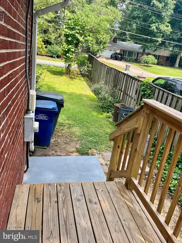 a view of balcony with wooden floor