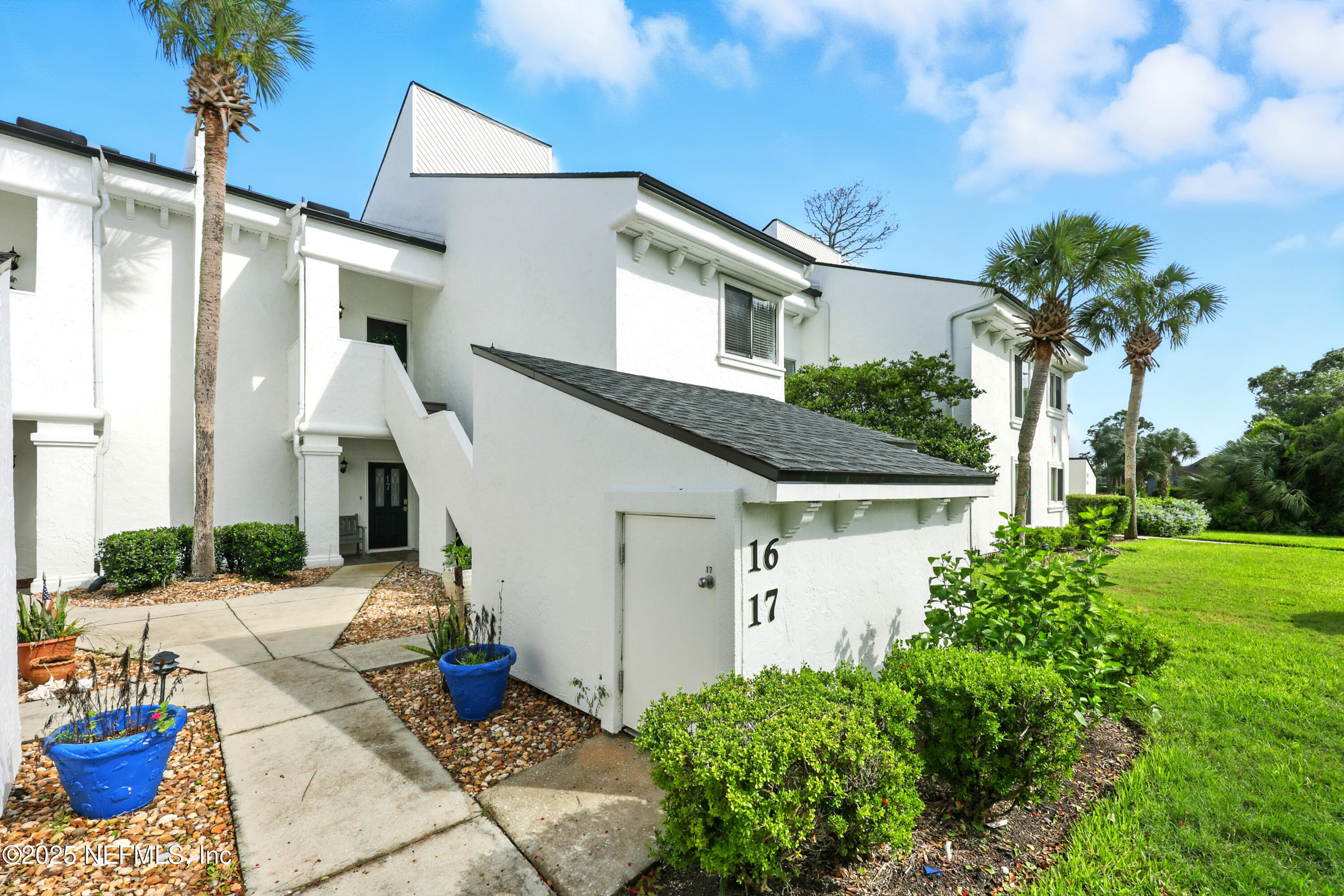 16 Cove Road Ponte Vedra Beach, FL 32082 - Photo 26 of 47 a front view of a house with garden