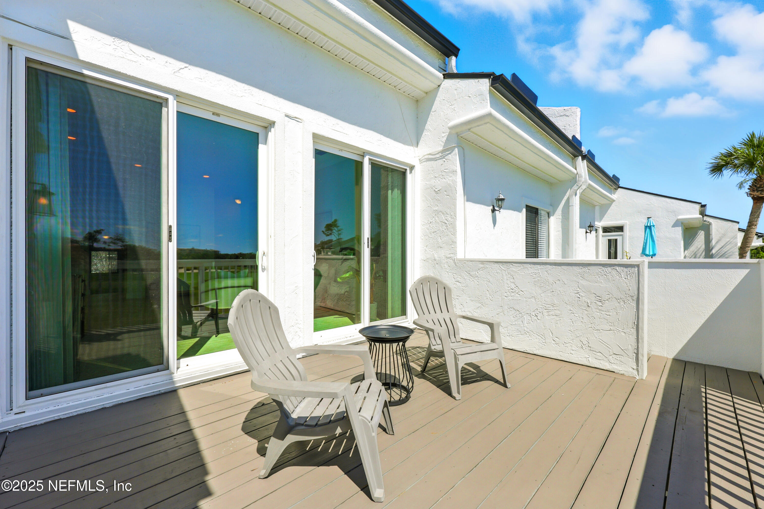 16 Cove Road Ponte Vedra Beach, FL 32082 - Photo 32 of 47 a view of a patio with couches table and chairs and potted plants