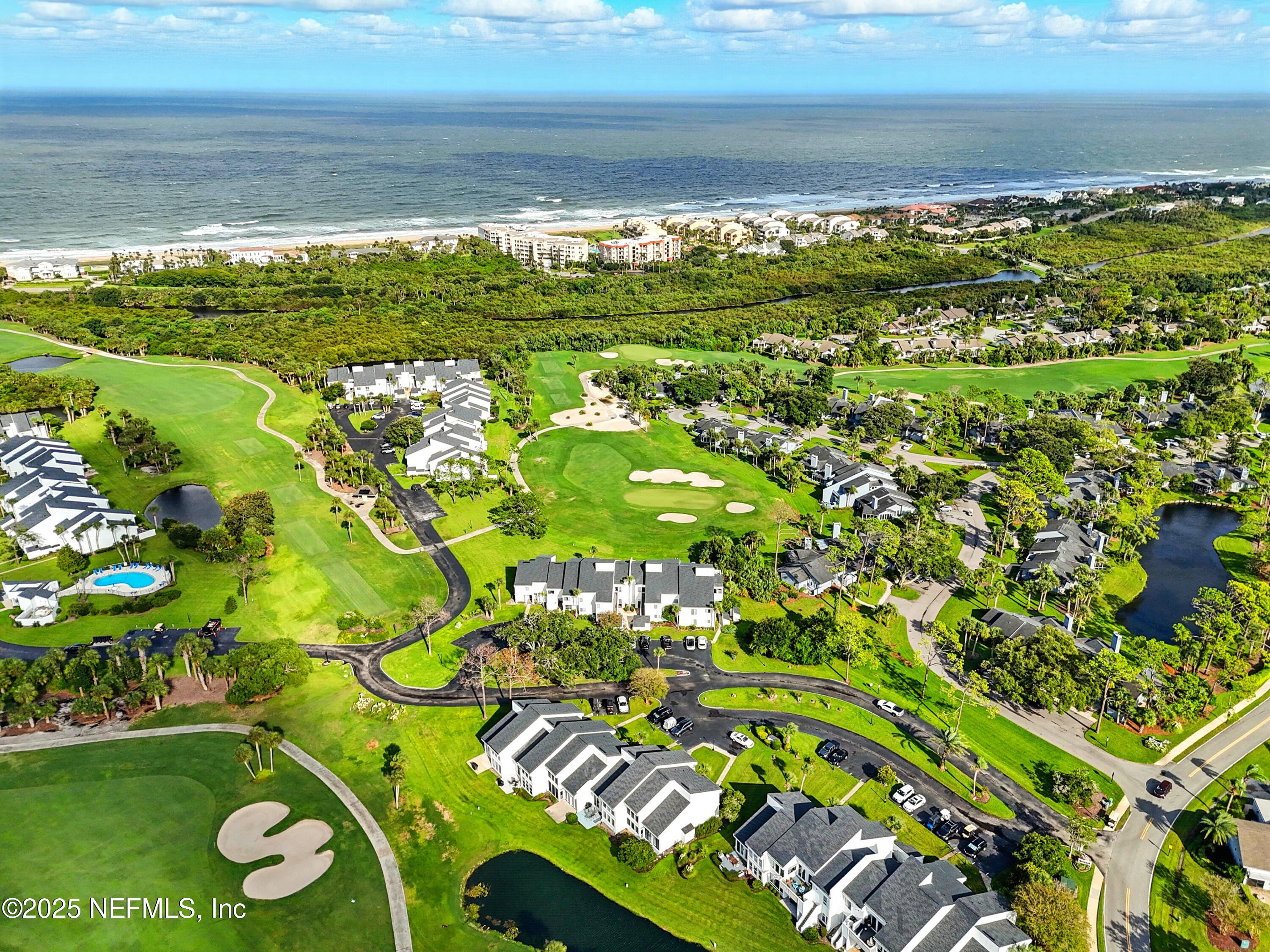 16 Cove Road Ponte Vedra Beach, FL 32082 - Photo 38 of 47 a view of a lake with a city