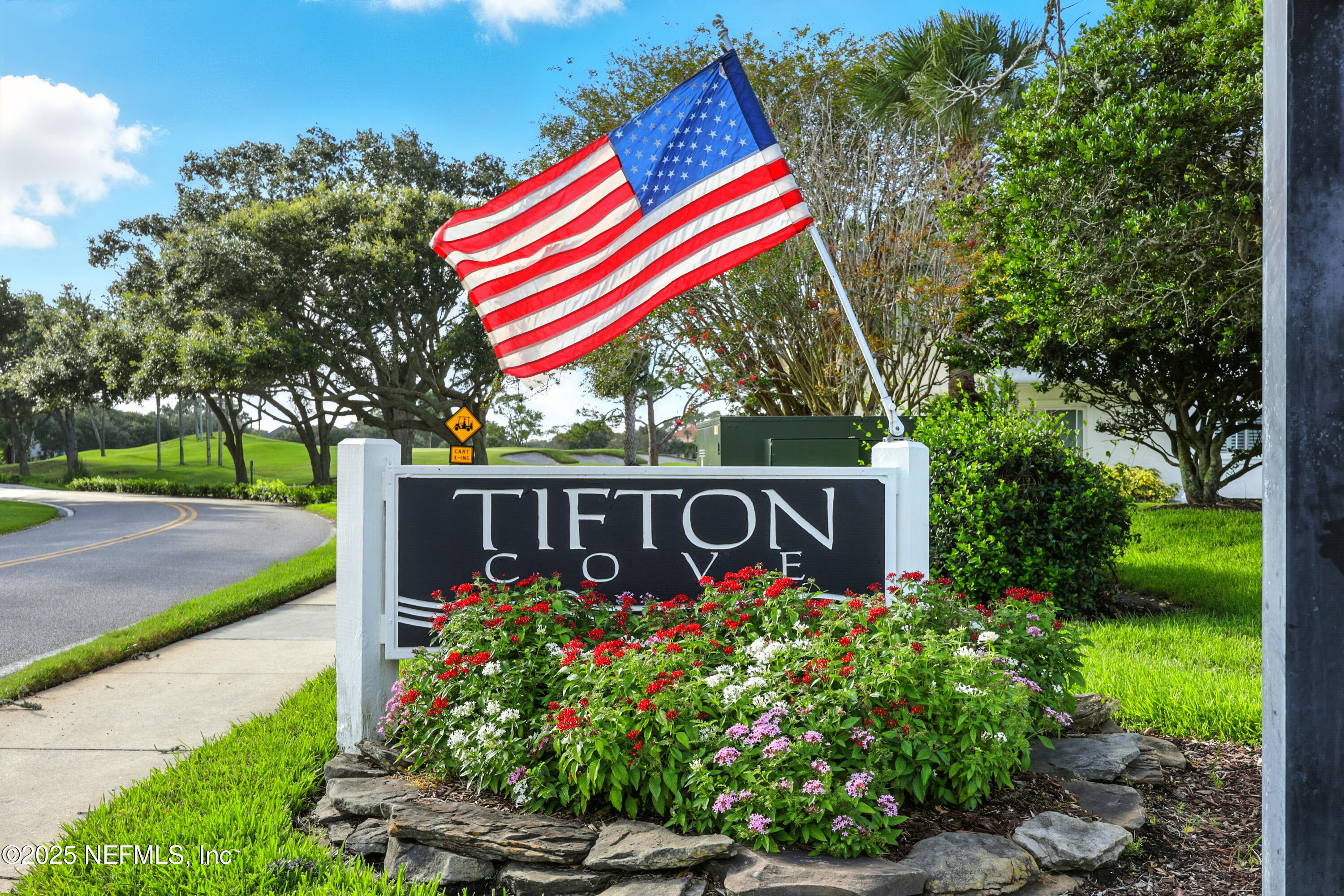 16 Cove Road Ponte Vedra Beach, FL 32082 - Photo 44 of 47 a sign that is in front of flowers